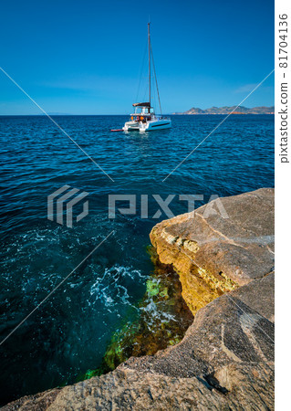 Yacht boat at Sarakiniko Beach in Aegean sea, Milos island , Greece 81704136