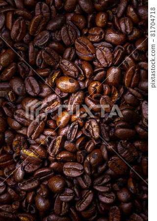 Close up to a heap of coffee beans. Macro photography of fresh roasted coffee beans high resolution. Detailed macro picture on roasted coffee beans. Close-up of brown coffee beans background image Close up to a heap of coffee beans. Macro photography of fresh roasted coffee beans high resolution. Detailed macro picture on roasted coffee beans. Close-up of brown coffee beans background image 81704718
