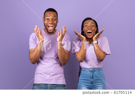 Portrait of excited young black couple hearing great news Portrait of excited young black couple hearing great news 81705114