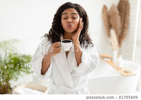 Black Lady Holding Coffee Cup Making Duck Face In Bathroom 81705609