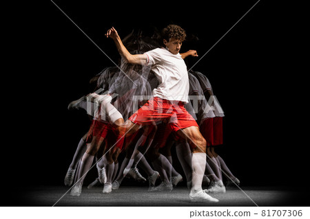 Young professional football player isolated on black background playing. Stroboscope effect 81707306