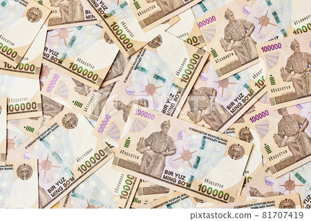 Pile of Uzbek sum currency money bill. A stack of one hundred thousand Uzbek sum. Uzbek money. 100000 sum 81707419