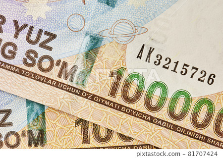 Macro shot of uzbek sum banknote. Pile of Uzbek sums. Uzbek currency money bill. A stack of one hundred thousand Uzbek sum. 100000 sum 81707424