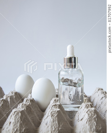 Glass bottle of egg serum for face. Glass bottle of egg serum for face. 81707992