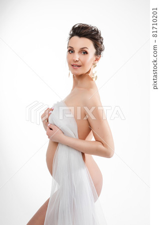 Sensual pregnant naked brunette woman with veil. Sensual pregnant naked brunette woman with veil. 81710201