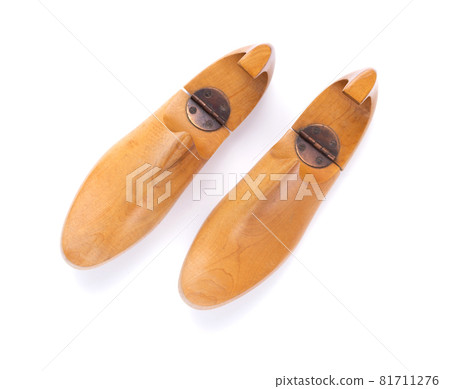 Wooden lasts shoes isolated at white background. Wood last for cobbler 81711276