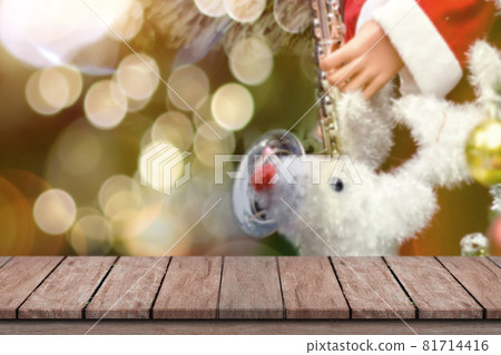 Christmas holiday background. Empty wooden deck table over bokeh light for product montage Christmas holiday background. Empty wooden deck table over bokeh light for product montage 81714416