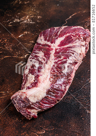 Raw hanging tender or onglet beef meat steak. Dark background. Top View 81716652