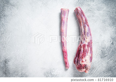 Raw whole Beef veal Oxtail Meat on butcher table. White background. Top view. Copy space Raw whole Beef veal Oxtail Meat on butcher table. White background. Top view. Copy space 81716910