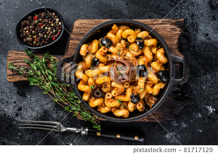 Pasta Cellentani Puttanesca seafood pasta in a pan. Black background. Top view Pasta Cellentani Puttanesca seafood pasta in a pan. Black background. Top view 81717120