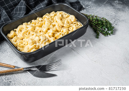 Mac and cheese american macaroni pasta with cheesy Cheddar sauce. White background. Top view. Copy space 81717230
