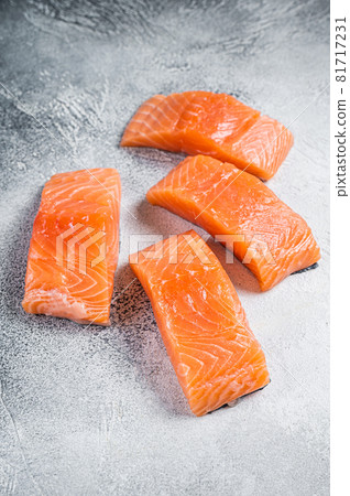 Raw salmon fillet steak on kitchen table. White background. Top view 81717231
