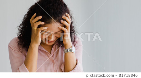 Middle age Asian woman feeling pain and suffer from sudden stroke attack and hold her head with suffer face. Concept of brain and head problem. 81718846