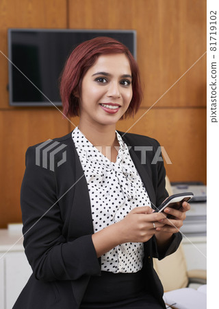 Texting Smiling Businesswoman Texting Smiling Businesswoman 81719102