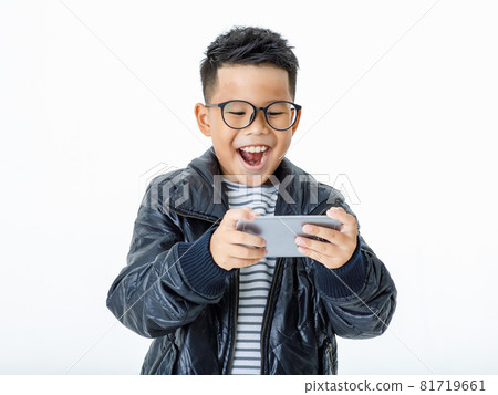 Cut out portrait of smart Asian boy wearing glasses and casual black jacket exciting and happily laugh as enjoy playing attractive funny game and interesting info on favorite mobile phone Cut out portrait of smart Asian boy wearing glasses and casual black jacket exciting and happily laugh as enjoy playing attractive funny game and interesting info on favorite mobile phone 81719661