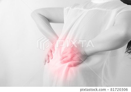 A woman putting her hands on her back A woman putting her hands on her back 81720306