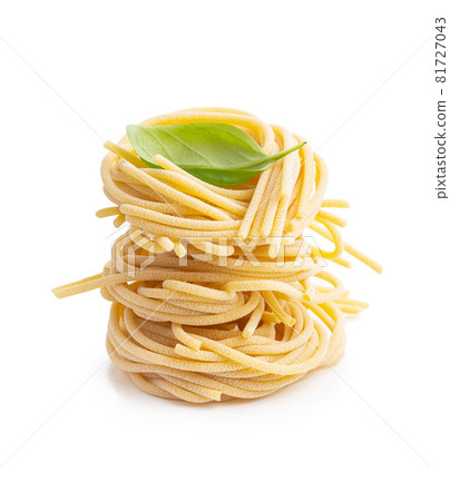 Italian pasta nest. Uncooked spaghetti nest. Italian pasta nest. Uncooked spaghetti nest. 81727043