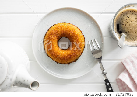Round sponge cake dessert. Sweet donut. 81727053