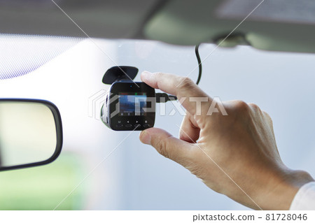 Male driver checking the drive recorder Male driver checking the drive recorder 81728046