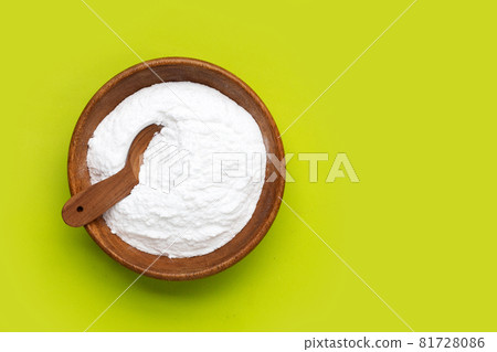 Baking soda on green background. Baking soda on green background. 81728086