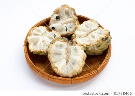 Custard apple in bamboo basket on white background. Custard apple in bamboo basket on white background. 81728466