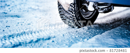 Car tires on winter road covered with snow Car tires on winter road covered with snow 81728481