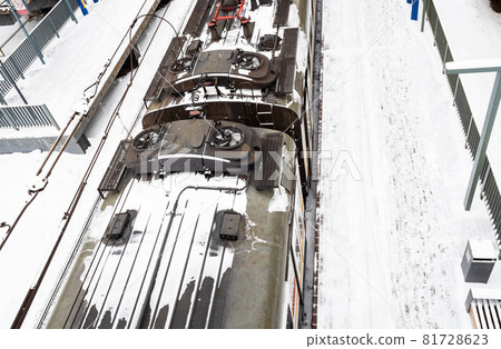 above view of train on railroad platform after snowfall in Moscow city on winter day above view of train on railroad platform after snowfall in Moscow city on winter day 81728623
