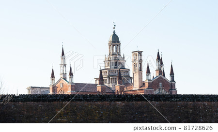 Travel to Italy - panoramic view of Certosa di Pavia Gra-Car (Carthusian Monastery, Monastero di Santa Maria delle Grazie, Santuario Gratiarum Carthusia) over fence near Pavia city, Lombardy 81728626