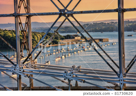 Construction of Royal Albert Bridge (railway) against sailboats on Tamar river between Devon and Cornwall, Plymouth area, England, UK Construction of Royal Albert Bridge (railway) against sailboats on Tamar river between Devon and Cornwall, Plymouth area, England, UK 81730620