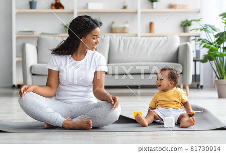 Yoga With Baby. Happy Black Mom And Infant Son Meditating At Home 81730914