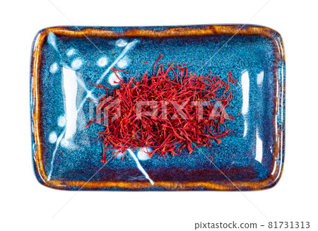 top view of natural saffron threads on rectangular plate cutout on white background top view of natural saffron threads on rectangular plate cutout on white background 81731313