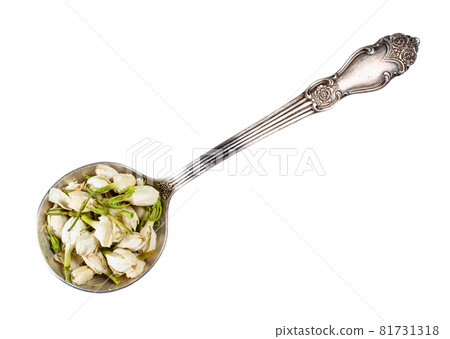 top view of dried jasmine blooms in silver spoon cutout on white background 81731318
