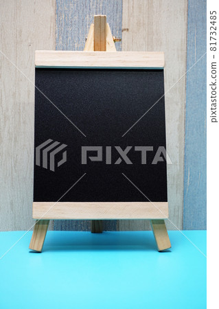 Space wooden easel black with space copy on wooden background Space wooden easel black with space copy on wooden background 81732485