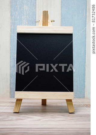 Space wooden easel black with space copy on wooden background Space wooden easel black with space copy on wooden background 81732486