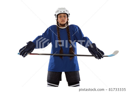 Full-length portrait of child girl hockey player isolated over ice rink 81733335