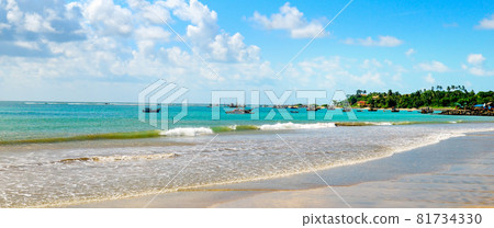 tropical beach and blue sea and white fluffy clouds. Wide photo. 81734330