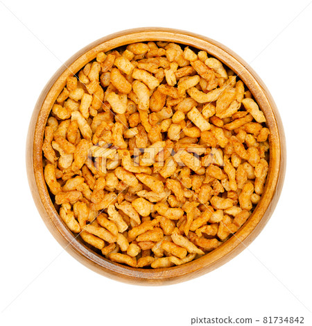Vegan minced meat, in a wooden bowl. Substitute and alternative for ground meat, based on seasoned pea protein, passed through a spiral screw mincer. Close-up from above, over white, macro food photo. 81734842