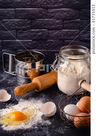 Table with baking products and tools. Table with baking products and tools. 81735913