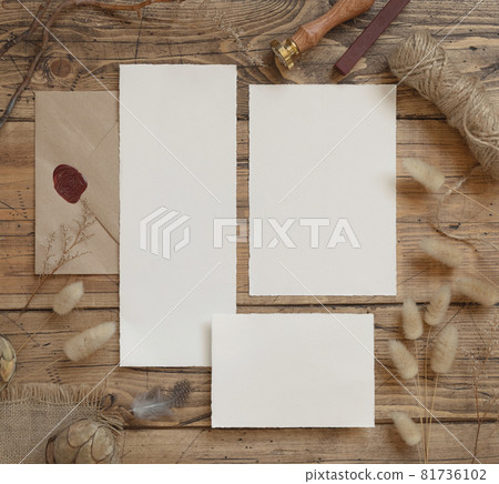 Wedding blank cards laying on a wooden table with bohemian decoration Wedding blank cards laying on a wooden table with bohemian decoration 81736102