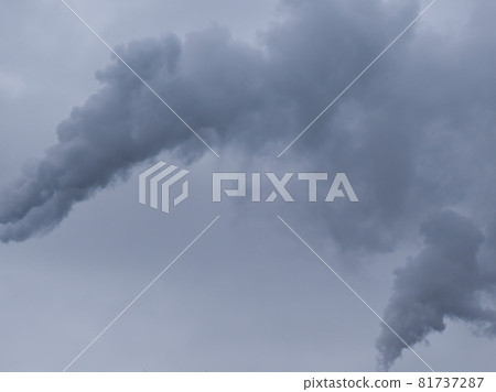 Puffs of gray smoke in the sky as a background. The sky is overcast. 81737287