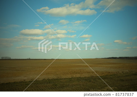 Beautiful cloudy sky over farmland. Spring landscape. Beautiful cloudy sky over farmland. Spring landscape. 81737837