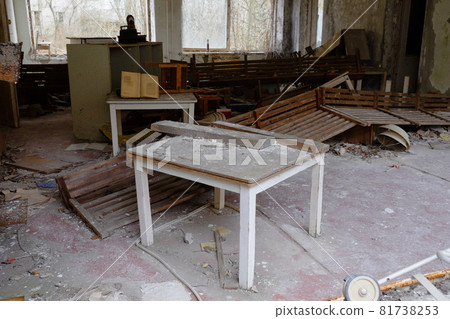 Old broken furniture in an abandoned building in Pripyat. A room in an abandoned kindergarten in the Chernobyl exclusion zone. Old broken furniture in an abandoned building in Pripyat. A room in an abandoned kindergarten in the Chernobyl exclusion zone. 81738253
