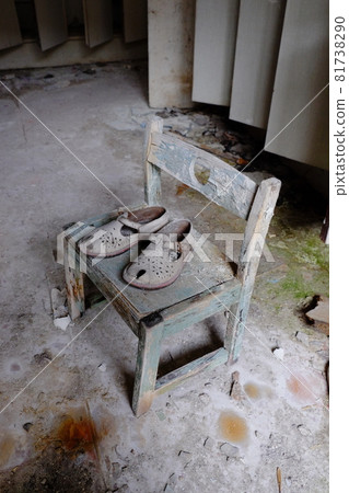 Small children's sandals in an abandoned kindergarten in Pripyat. Old children's shoes. Small children's sandals in an abandoned kindergarten in Pripyat. Old children's shoes. 81738290