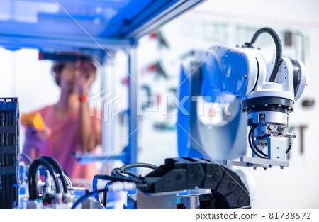 Asian male Engineers Maintenance Robot Arm at Lab. he are in a High Tech Research Laboratory with Modern Equipment. Technology and Innovation Concept.. Asian male Engineers Maintenance Robot Arm at Lab. he are in a High Tech Research Laboratory with Modern Equipment. Technology and Innovation Concept.. 81738572
