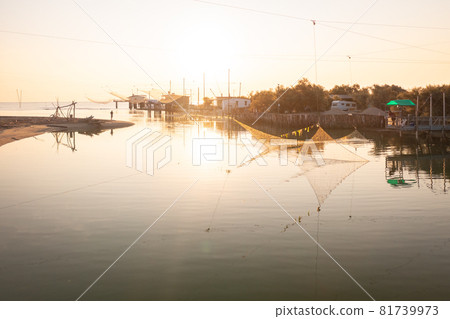 Romantic view of the fishing huts at dawn Romantic view of the fishing huts at dawn 81739973