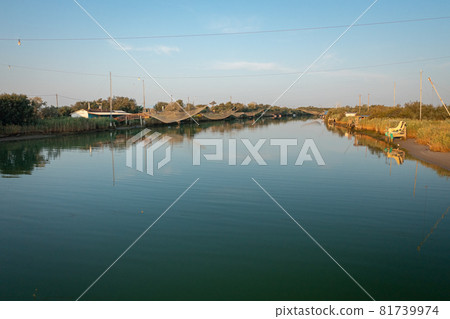 Panorama shot of fishing huts on river Panorama shot of fishing huts on river 81739974