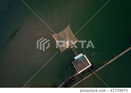 Birds view of fishing hut on river 81739975