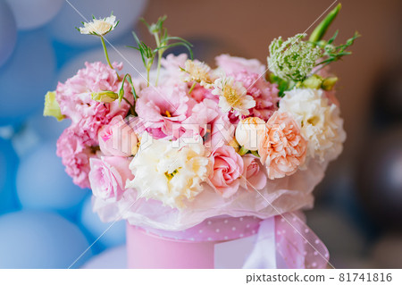 bouquet of delicate white and pink peony roses in a hat box. Floristics. bouquet of delicate white and pink peony roses in a hat box. Floristics. 81741816