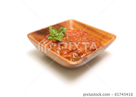 Tomato sauce in a wooden bowl on a white background 81743418