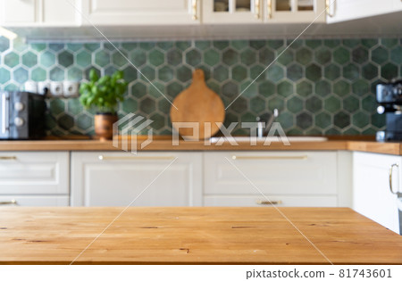 blurred kitchen interior and wooden desk space home background 81743601